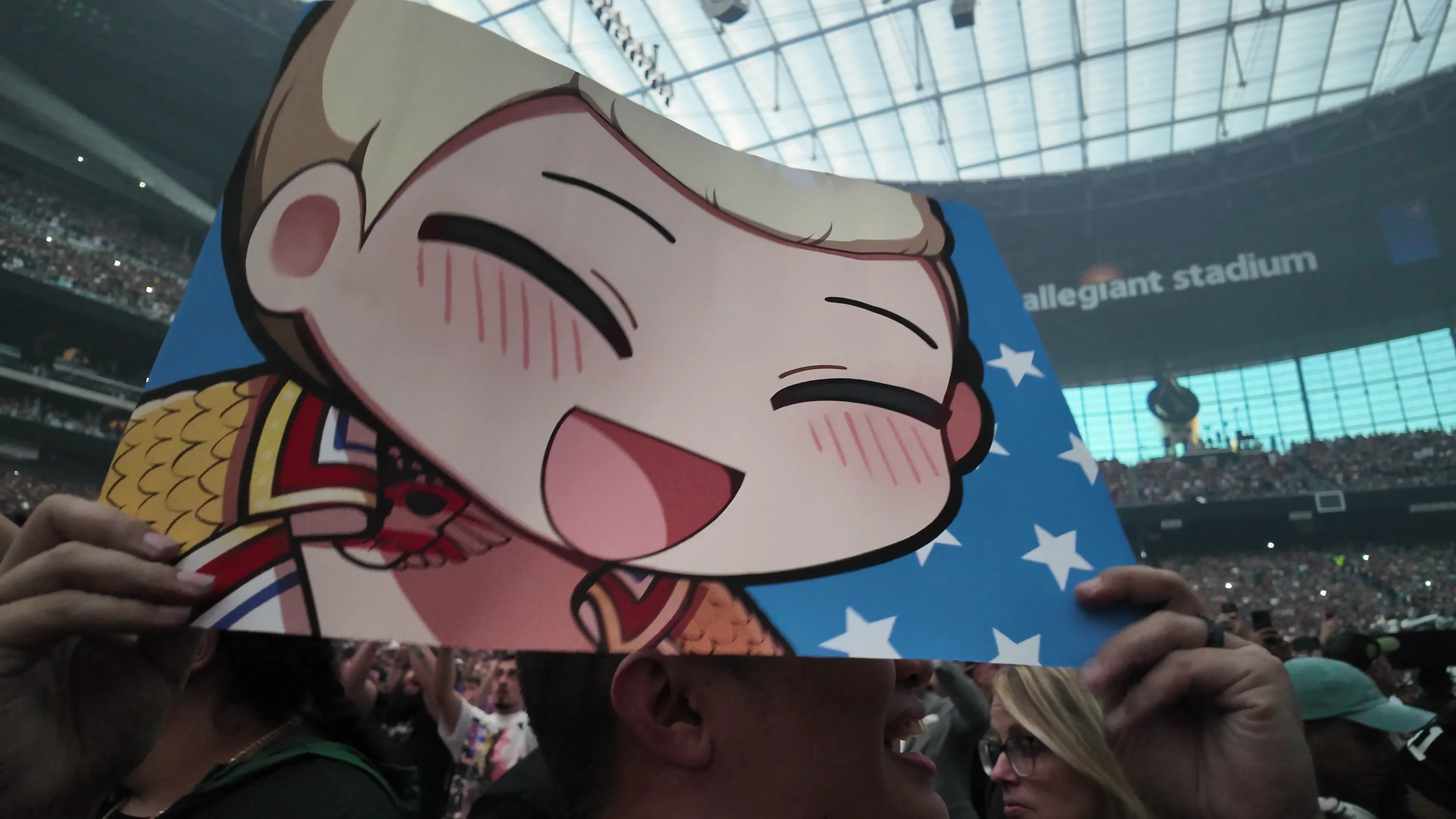 Me holding a sign at WrestleMania 41.